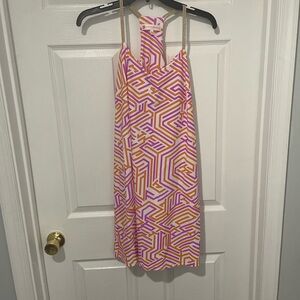 Jude Connally orange and purple cocktail dress.